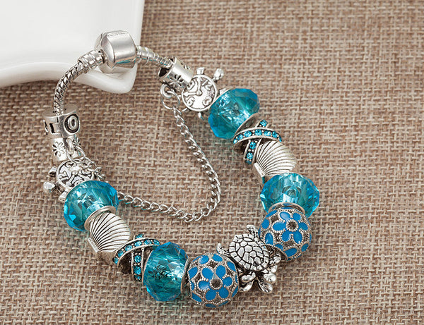 Blue Glass Sea Turtles Charm Bracelet