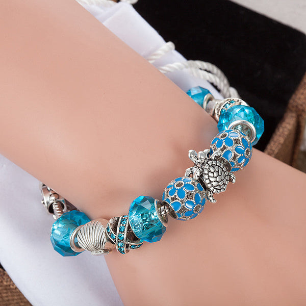 Blue Glass Sea Turtles Charm Bracelet