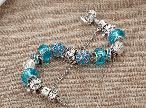 Blue Glass Sea Turtles Charm Bracelet